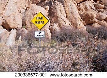 Stock Photography - warning sign in 
dry brush. fotosearch 
- search stock 
photos, pictures, 
images, and photo 
clipart