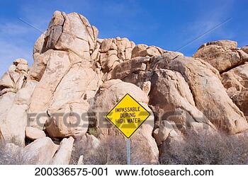 Stock Photography - warning sign in 
front of granite 
boulders. fotosearch 
- search stock 
photos, pictures, 
images, and photo 
clipart