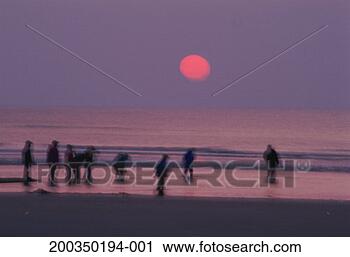 Stock Photography - belgium, ostend, 
people on beach 
at dusk (long 
exposure). fotosearch 
- search stock 
photos, pictures, 
images, and photo 
clipart