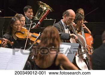 Stock Photography - cello and viola 
section of orchestra 
during performance. 
fotosearch - search 
stock photos, 
pictures, images, 
and photo clipart