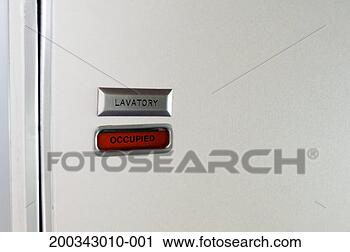 Stock Photography - close-up of airline 
lavatory door 
with sign reading 
'occupied'. fotosearch 
- search stock 
photos, pictures, 
images, and photo 
clipart