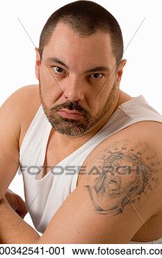 Stock Photography - man with jesus 
tattoo on arm, 
portrait. fotosearch 
- search stock 
photos, pictures, 
images, and photo 
clipart