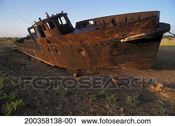 Stock Photography - uzbekistan, karakalpakia, 
aral sea, derelict 
boat on dry seabed. 
fotosearch - search 
stock photos, 
pictures, images, 
and photo clipart
