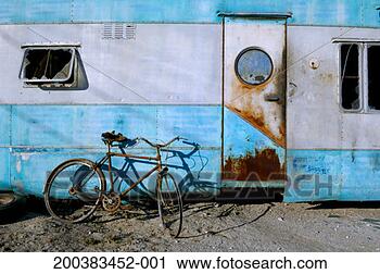 Stock Photography - bicycle leaning 
against derelict 
trailer. fotosearch 
- search stock 
photos, pictures, 
images, and photo 
clipart