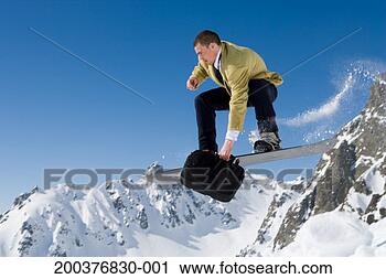 Stock Photography - businessman performing 
jump on snowboard. 
fotosearch - search 
stock photos, 
pictures, images, 
and photo clipart