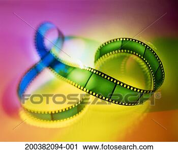 Stock Photography - film strip in 
coloured light, 
close-up (defocussed). 
fotosearch - search 
stock photos, 
pictures, images, 
and photo clipart