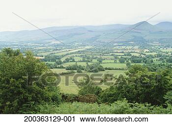 Stock Photography - ireland, county 
tipperary, galtee 
mountains and 
valley, elevated 
view. fotosearch 
- search stock 
photos, pictures, 
images, and photo 
clipart
