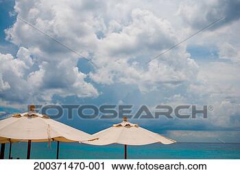 Stock Photography - mexico, yucatan, 
quintana roo, 
cozumel, beach 
umbrellas and 
ocean. fotosearch 
- search stock 
photos, pictures, 
images, and photo 
clipart
