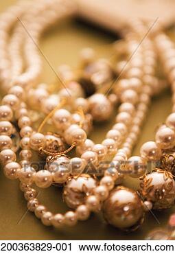 Stock Photography - strings of pearls 
(focus on foreground). 
fotosearch - search 
stock photos, 
pictures, images, 
and photo clipart