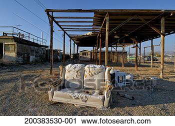 Stock Photography - usa, california, 
bombay beach, 
loveseat in front 
of derelict houses. 
fotosearch - search 
stock photos, 
pictures, images, 
and photo clipart