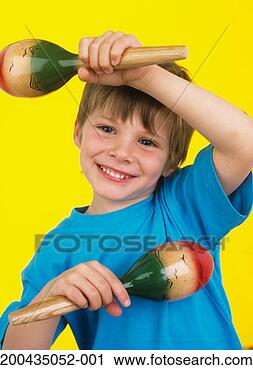 Stock Photography - boy (3-5) holding 
percussion instruments, 
smiling, portrait. 
fotosearch - search 
stock photos, 
pictures, images, 
and photo clipart