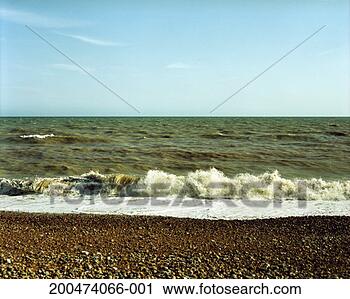 Stock Photography - england, brighton, 
wave hitting pebble 
beach. fotosearch 
- search stock 
photos, pictures, 
images, and photo 
clipart
