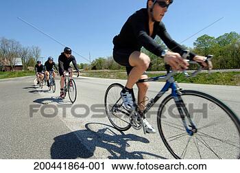Stock Photography - group of cyclists 
on rural road. 
fotosearch - search 
stock photos, 
pictures, images, 
and photo clipart