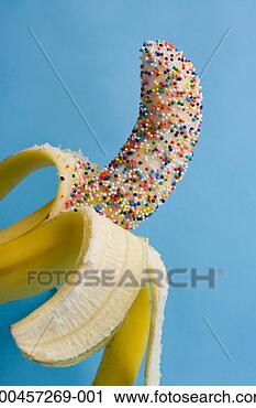 Stock Photography - half peeled banana 
covered in hundreds 
and thousands, 
close-up. fotosearch 
- search stock 
photos, pictures, 
images, and photo 
clipart