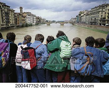 Stock Photography - italy, florence, 
ponte vecchio, 
crowd looking 
at arno river, 
rear view. fotosearch 
- search stock 
photos, pictures, 
images, and photo 
clipart