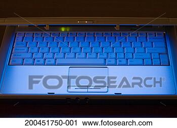 Stock Photography - laptop computer 
opening showing 
glow from screen, 
close-up. fotosearch 
- search stock 
photos, pictures, 
images, and photo 
clipart