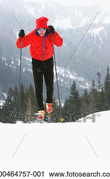 Stock Photography - man cross country 
skiing, elevated 
view. fotosearch 
- search stock 
photos, pictures, 
images, and photo 
clipart