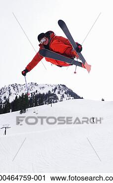 Stock Photography - man jumping on 
skis, low angle 
view. fotosearch 
- search stock 
photos, pictures, 
images, and photo 
clipart