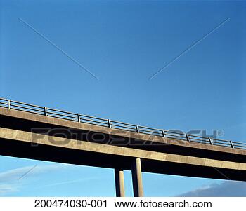 Stock Photography - road bridge with 
clear sky, low 
angle view. fotosearch 
- search stock 
photos, pictures, 
images, and photo 
clipart