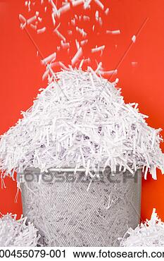Stock Photography - shredded paper 
falling onto overflowing 
wastepaper bin, 
close-up. fotosearch 
- search stock 
photos, pictures, 
images, and photo 
clipart
