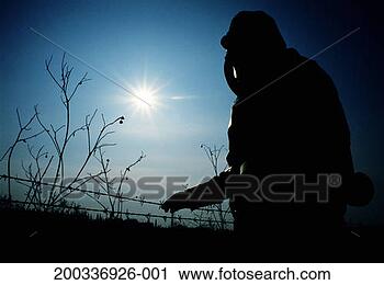 Stock Photography - silhouette of 
person in toxic 
waste protection 
suit, side view. 
fotosearch - search 
stock photos, 
pictures, images, 
and photo clipart
