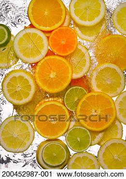 Stock Photography - slices of lemon, 
limes and oranges 
in water, close-up, 
cross section. 
fotosearch - search 
stock photos, 
pictures, images, 
and photo clipart
