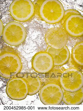 Stock Photography - slices of lemon 
in water, close-up, 
cross section. 
fotosearch - search 
stock photos, 
pictures, images, 
and photo clipart