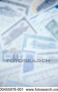 Stock Photography - stocks and bonds 
certificates (defocussed), 
close-up. fotosearch 
- search stock 
photos, pictures, 
images, and photo 
clipart