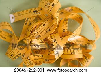Stock Photography - tape measure, 
tangled up, close-up. 
fotosearch - search 
stock photos, 
pictures, images, 
and photo clipart
