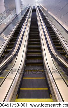 Stock Photography - triple escalator 
(blurred motion). 
fotosearch - search 
stock photos, 
pictures, images, 
and photo clipart