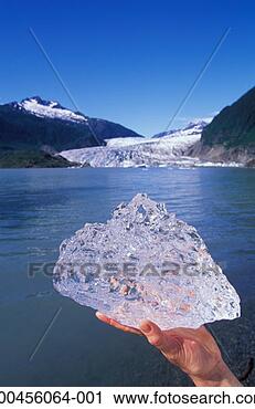 Stock Photography - usa, alaska, juneau, 
mendenhall glacier, 
holding ice by 
glacier. fotosearch 
- search stock 
photos, pictures, 
images, and photo 
clipart