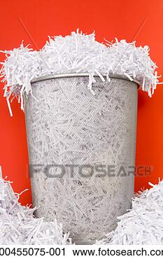 Stock Photography - wastepaper bin 
overflowing with 
shredded paper, 
close-up. fotosearch 
- search stock 
photos, pictures, 
images, and photo 
clipart