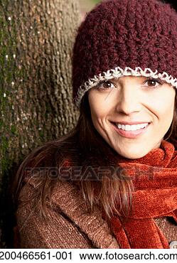 Stock Photography - woman wearing 
hat and scarf, 
portrait, close-up. 
fotosearch - search 
stock photos, 
pictures, images, 
and photo clipart