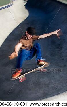 Stock Photography - young man performing 
trick on skateboard, 
elevated view. 
fotosearch - search 
stock photos, 
pictures, images, 
and photo clipart