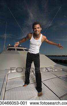 Stock Photography - young man on yacht 
wearing gold chains, 
close-up. fotosearch 
- search stock 
photos, pictures, 
images, and photo 
clipart