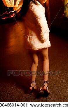 Stock Photography - young woman wearing 
high heels (blurred 
motion), night, 
rear view. fotosearch 
- search stock 
photos, pictures, 
images, and photo 
clipart