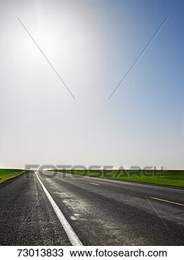 Stock Photo - empty two lane 
highway. fotosearch 
- search stock 
photos, pictures, 
images, and photo 
clipart