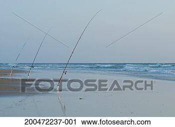 Stock Photography - france, le porge 
beach, three fishing 
rods on beach, 
outdoors. fotosearch 
- search stock 
photos, pictures, 
images, and photo 
clipart