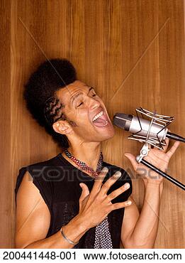 Stock Photography - man singing into 
microphone. fotosearch 
- search stock 
photos, pictures, 
images, and photo 
clipart