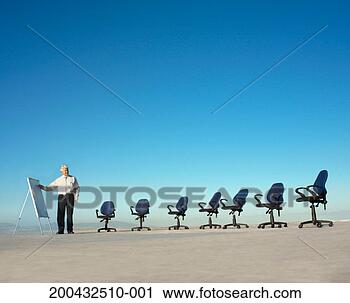 Stock Photography - mature business 
man on roof, empty 
seats. fotosearch 
- search stock 
photos, pictures, 
images, and photo 
clipart