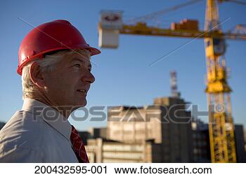 Stock Photography - mature business 
man wearing hard 
hat, side view. 
fotosearch - search 
stock photos, 
pictures, images, 
and photo clipart