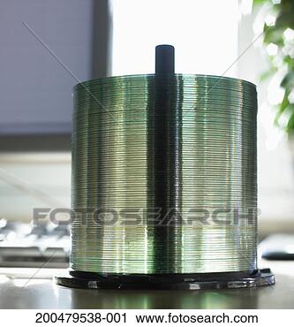 Stock Photography - stack of compact 
disks on spindle, 
close-up. fotosearch 
- search stock 
photos, pictures, 
images, and photo 
clipart