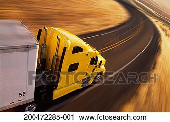 Stock Photography - truck driving 
along road (blurred 
motion), elevated 
view, side view. 
fotosearch - search 
stock photos, 
pictures, images, 
and photo clipart