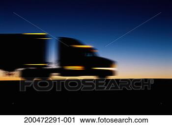 Stock Photography - truck driving 
along road (blurred 
motion), dusk, 
side view. fotosearch 
- search stock 
photos, pictures, 
images, and photo 
clipart