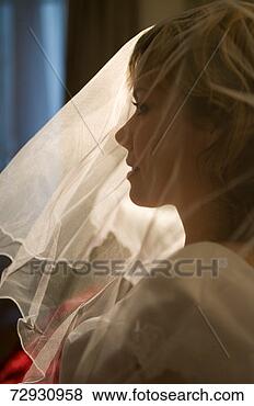 Stock Photo - young woman wearing 
veil, profile. 
fotosearch - search 
stock photos, 
pictures, images, 
and photo clipart