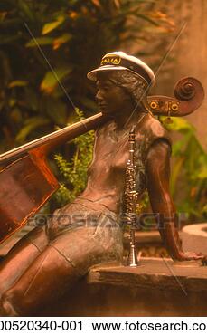 Stock Photography - bronze statue 
of girl sitting 
by musical instruments, 
outdoors. fotosearch 
- search stock 
photos, pictures, 
images, and photo 
clipart