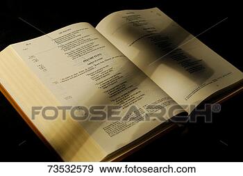Stock Photograph - crucifix shadow 
on french holy 
bible, close-up. 
fotosearch - search 
stock photos, 
pictures, images, 
and photo clipart