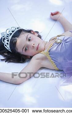 Stock Photography - girl (4-6) lying 
down, wearing 
tutu and tiara, 
close-up. fotosearch 
- search stock 
photos, pictures, 
images, and photo 
clipart