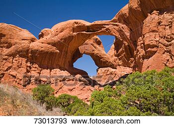 Stock Photo - usa, utah, arches 
national park, 
double arch, low 
angle view. fotosearch 
- search stock 
photos, pictures, 
images, and photo 
clipart