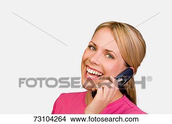 Stock Photo - young woman using 
mobile phone, 
smiling, portrait. 
fotosearch - search 
stock photos, 
pictures, images, 
and photo clipart